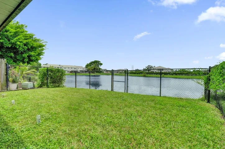 BEAUTIFUL FENCED IN BACK YARD ON WIDE LAKE