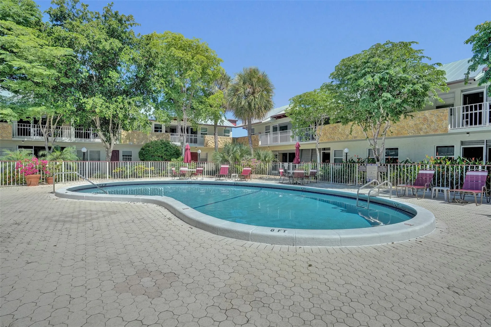 Renovated pool and sundeck with beautiful pavers.