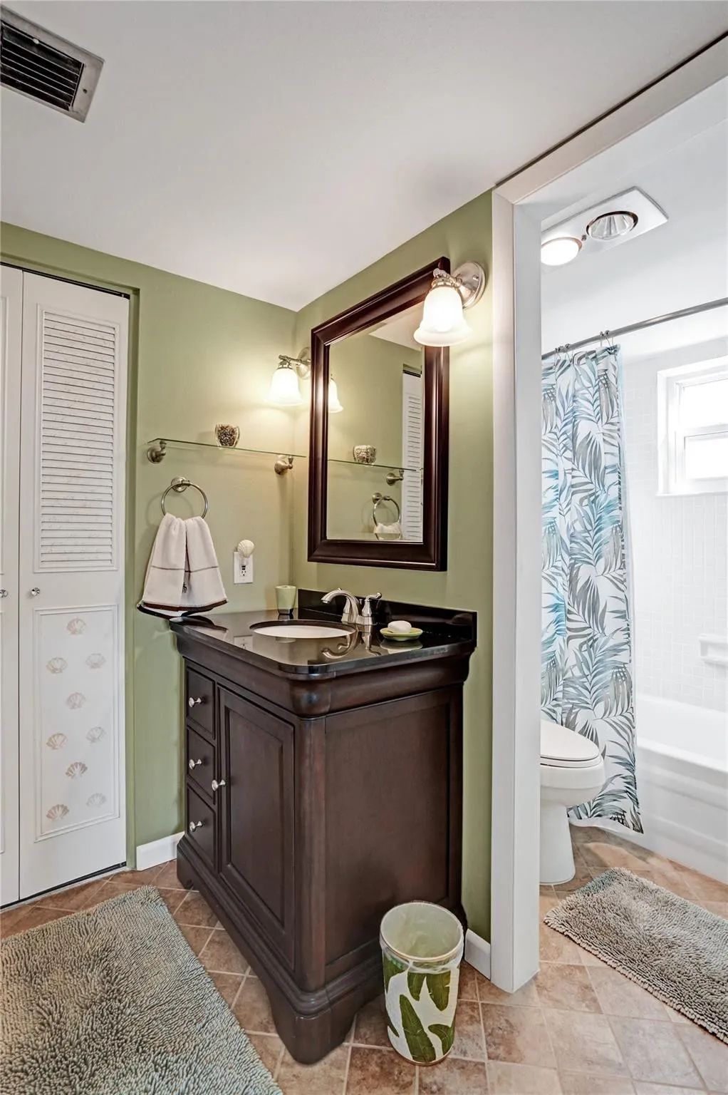 Guest ensuite bathroom with updated vanity.