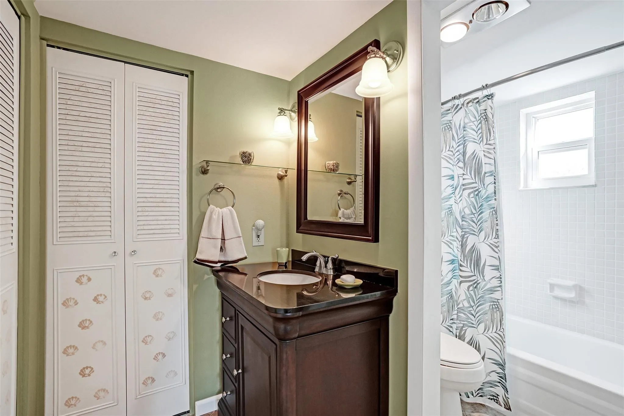 Guest ensuite bathroom with updated vanity and 2 closets.