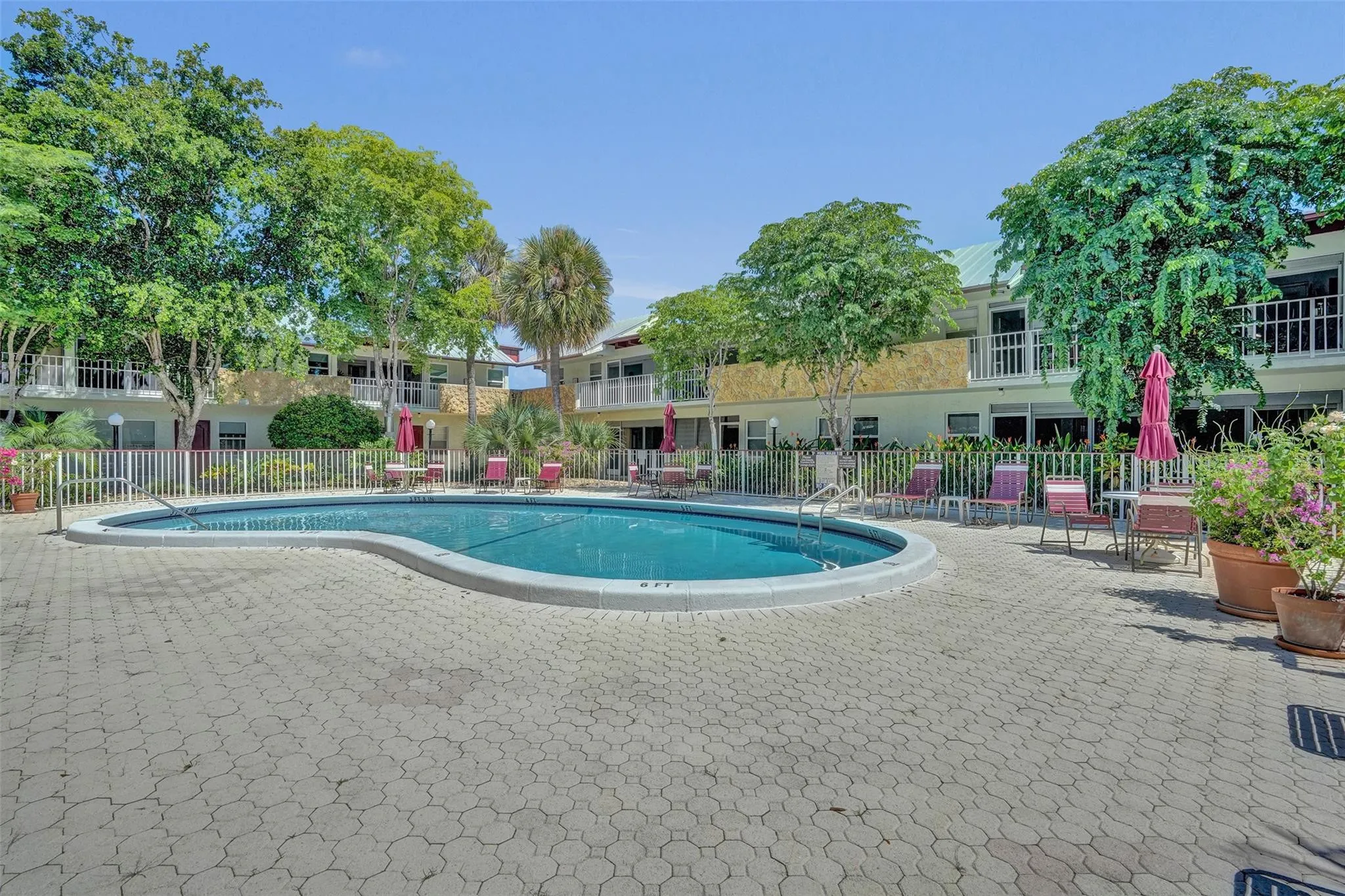 Renovated pool and sundeck with beautiful pavers.