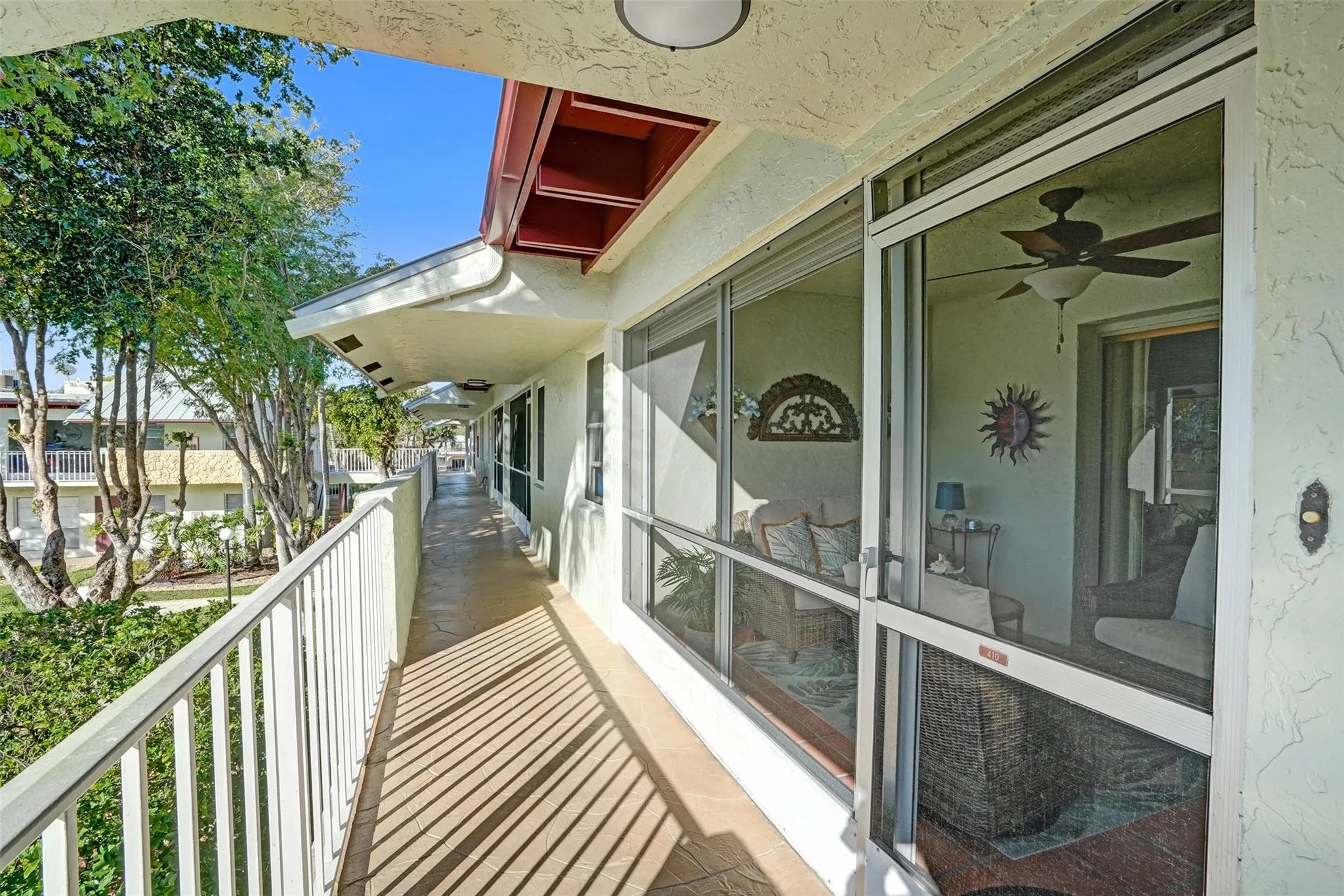 Charming covered catwalk guiding you to the screened -in lanai entrance
