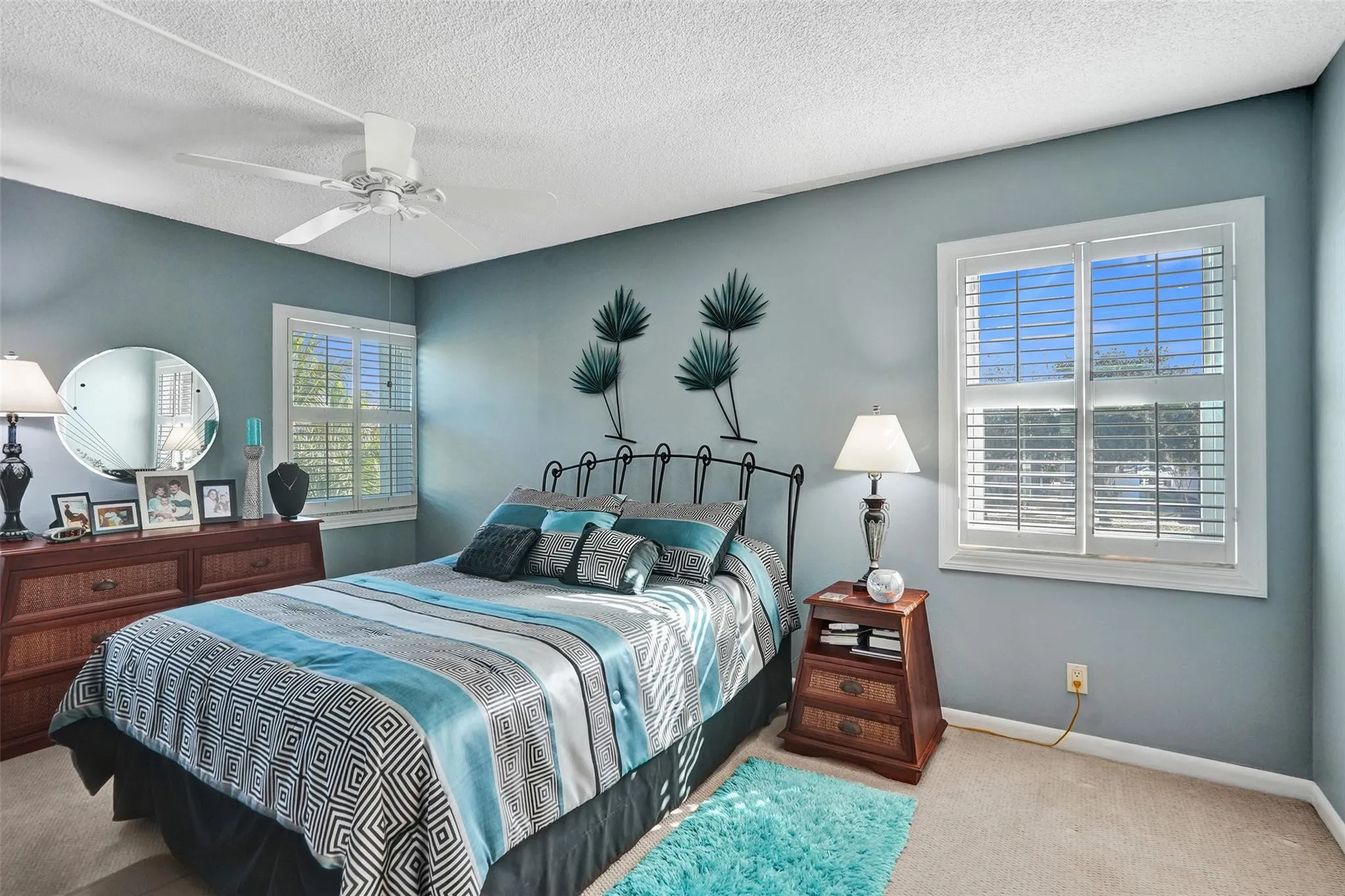 Light filled primary bedroom perfect for unwinding.