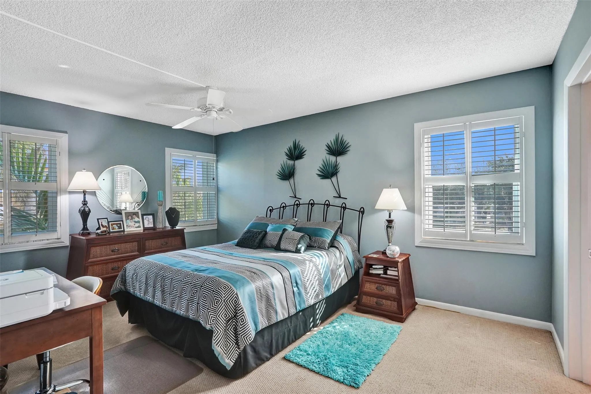 Sunlit, Spacious Primary Bedroom with renovated bathroom .