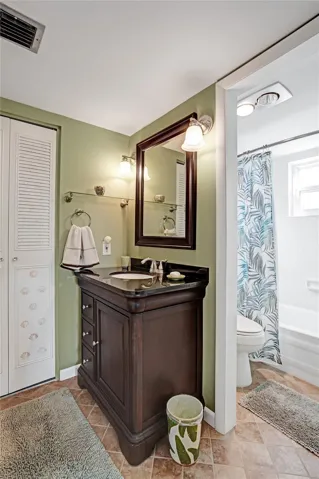 Guest ensuite bathroom with updated vanity.