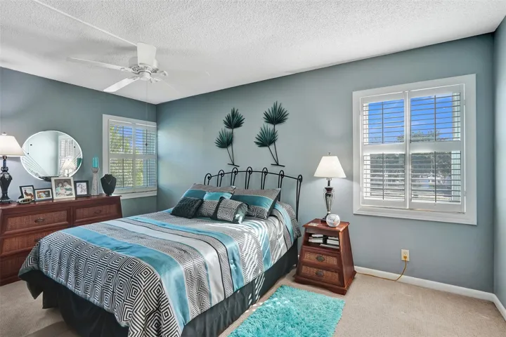 Light filled primary bedroom perfect for unwinding.