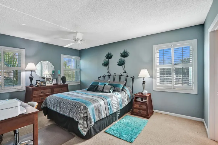 Sunlit, Spacious Primary Bedroom with renovated bathroom .