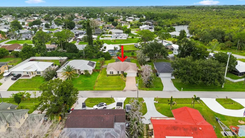 Single-story residence featuring an attached garage and a pavered driveway