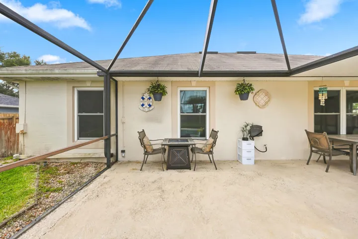 Screened patio featuring a concrete surface and direct access to the interior