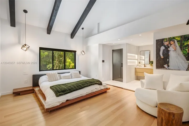 A private retreat featuring vaulted ceilings, warm natural finishes, and a spa-inspired atmosphere designed for relaxation and comfort.