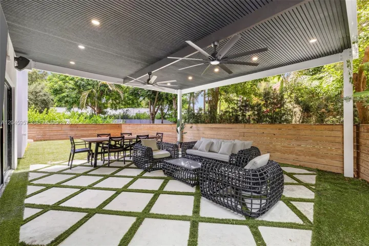 An extension of the home’s entertaining spaces, the covered terrace offers year-round outdoor living with generous seating, dining, and seamless indoor-outdoor flow.