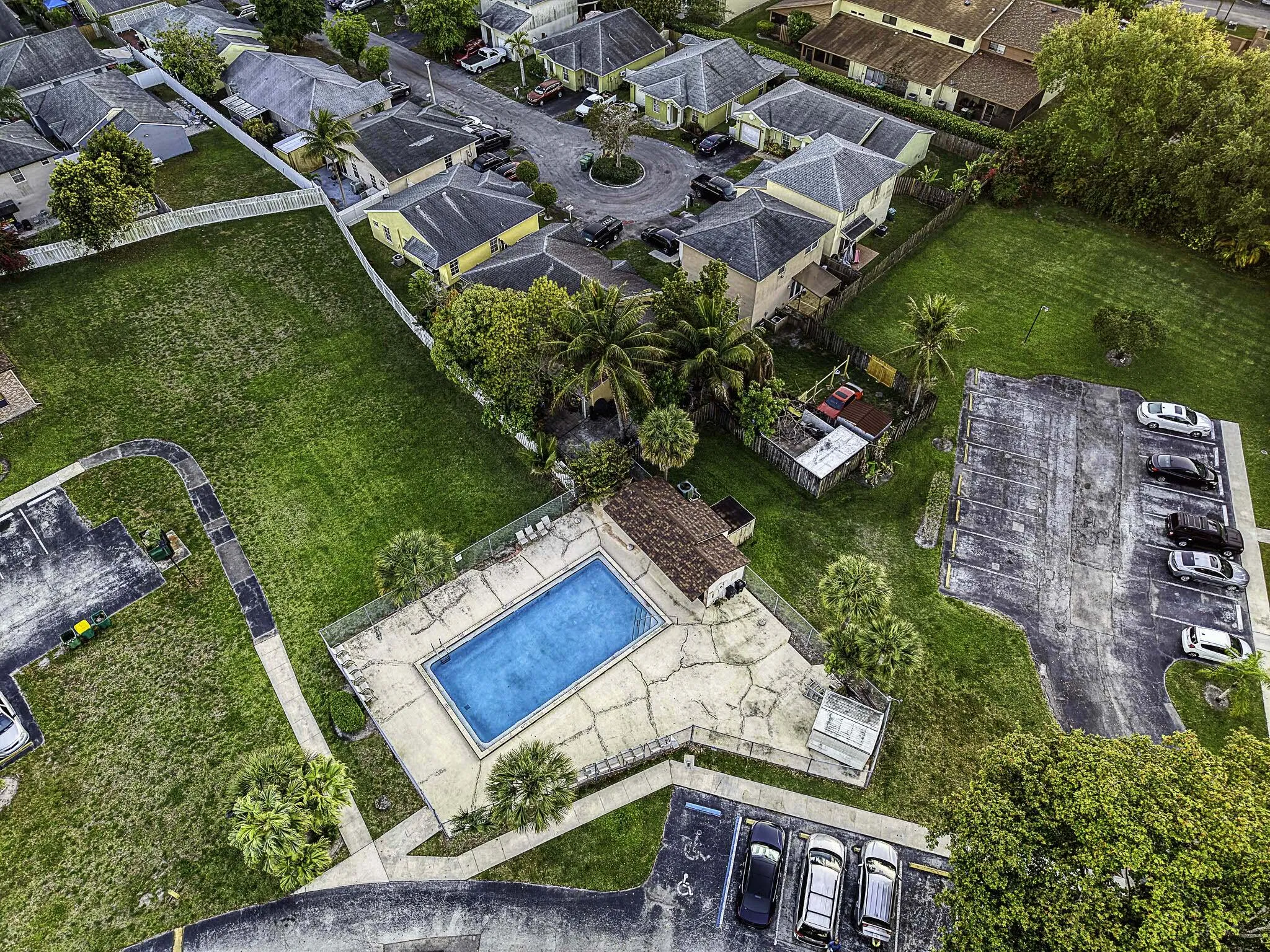 Community swimming pool with surrounding concrete deck