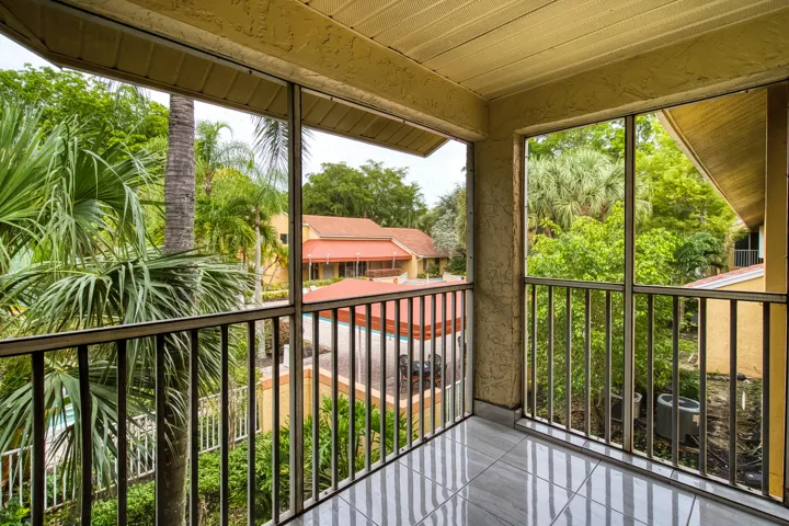Screened patio overlooking pool and clubhouse