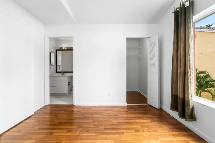 Guest bedroom with vaulted ceilings and lots of natural light