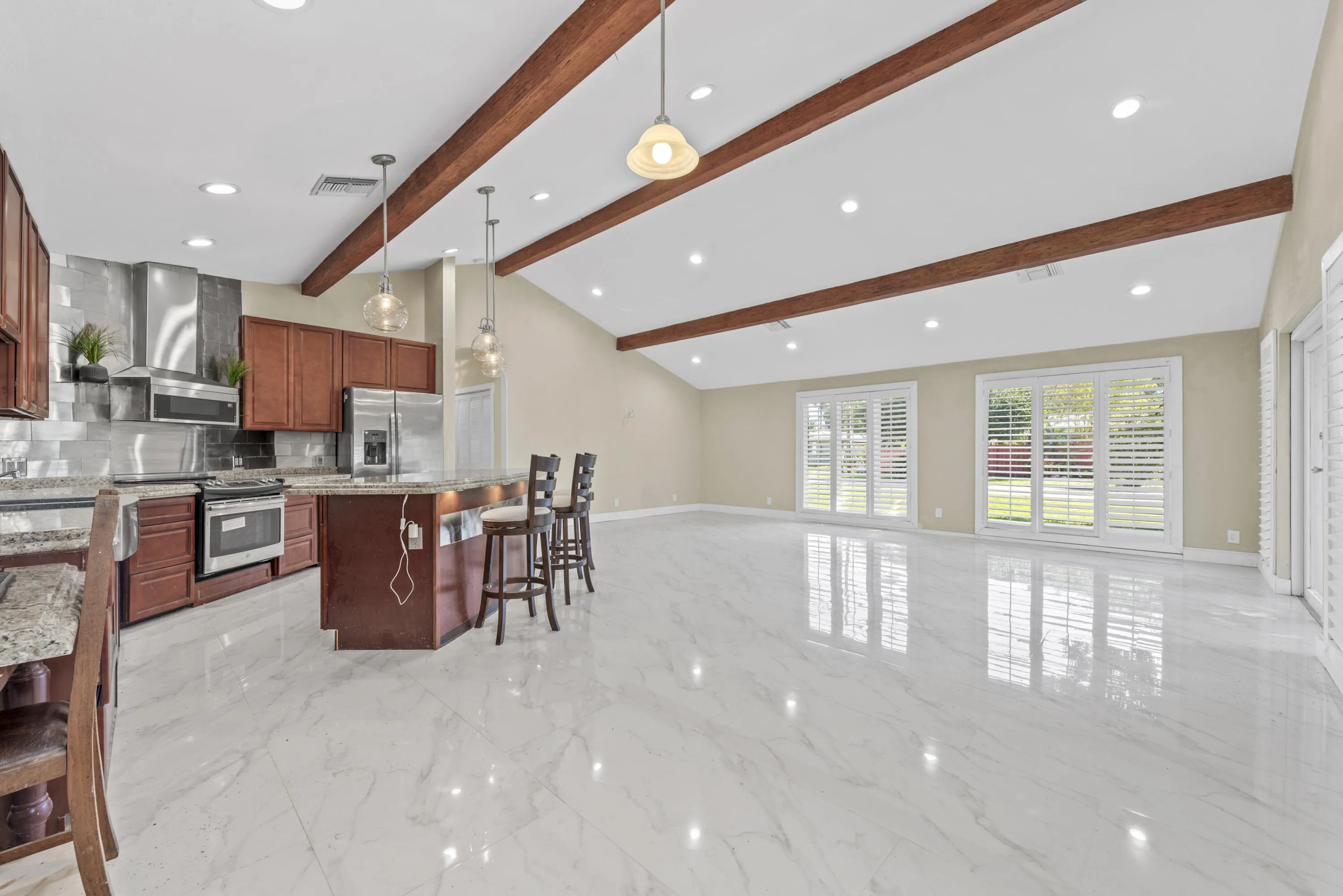 Lots of light, impact windows with plantation shutters