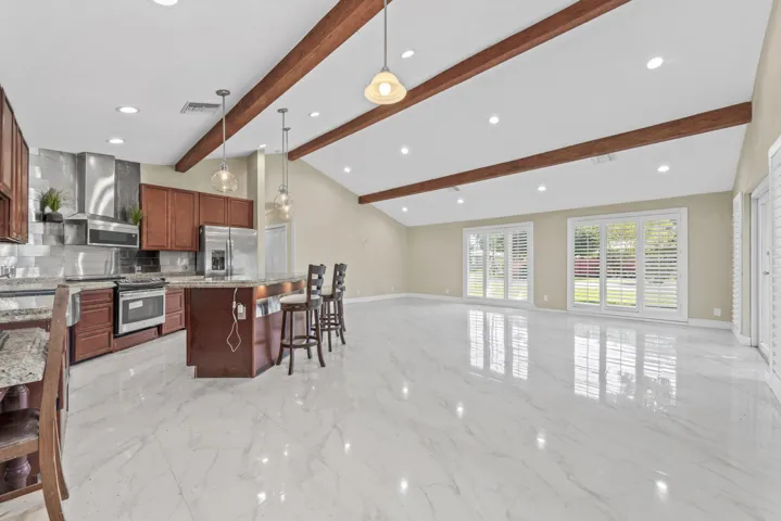 Lots of light, impact windows with plantation shutters
