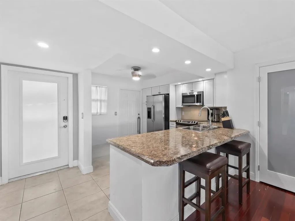 Kitchen with eat in breakfast bar