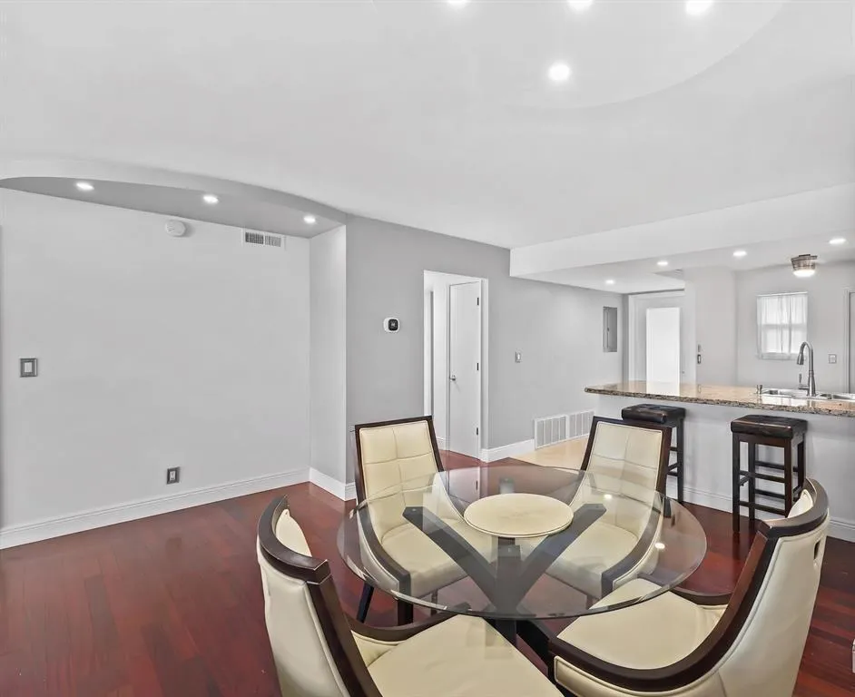 This open concept Living Room, Dining room, Florida Room is very spacious and offers amazing canal views to watch the boats and relax.