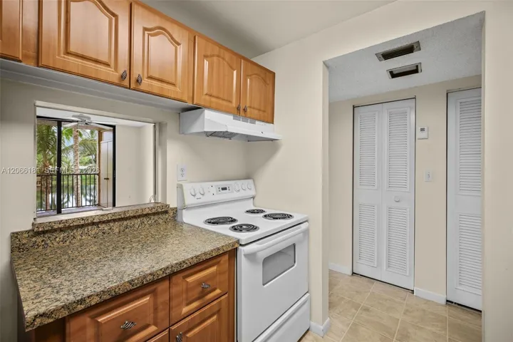 You can see the lake from inside the kitchen. Coat closet and AC closet by the front door.
