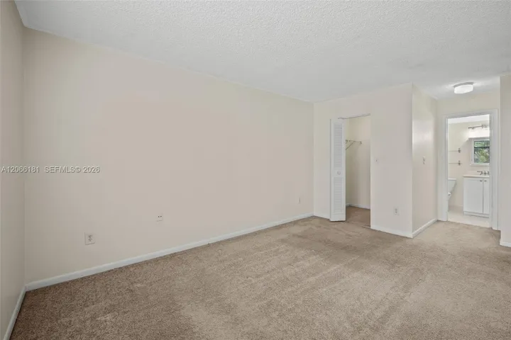 Bedroom view towards bathroom and walk in closet