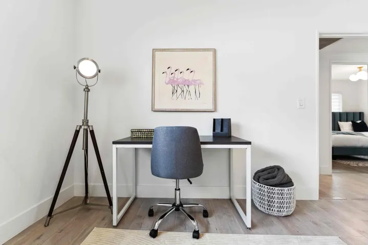 Light-toned wood-finish flooring provides a neutral base for this functional space