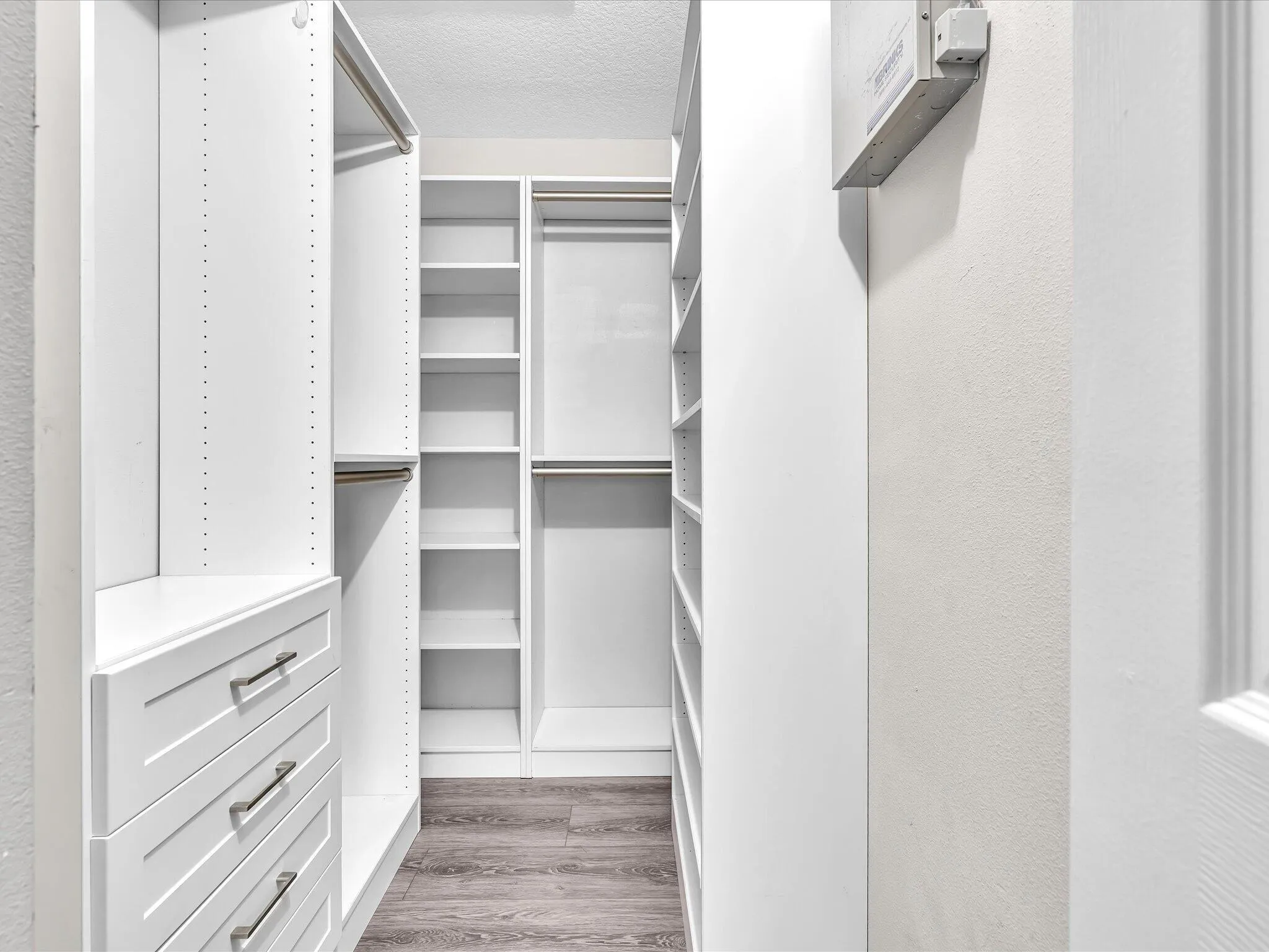 Walk-in closet with built in custom cabinets