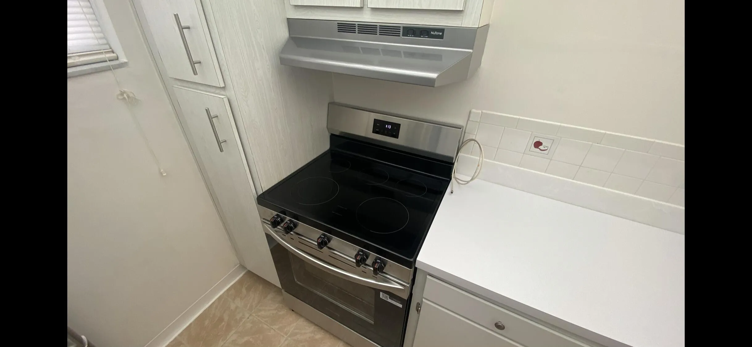 Brand new Stainless steel electric range with a coordinating range hood