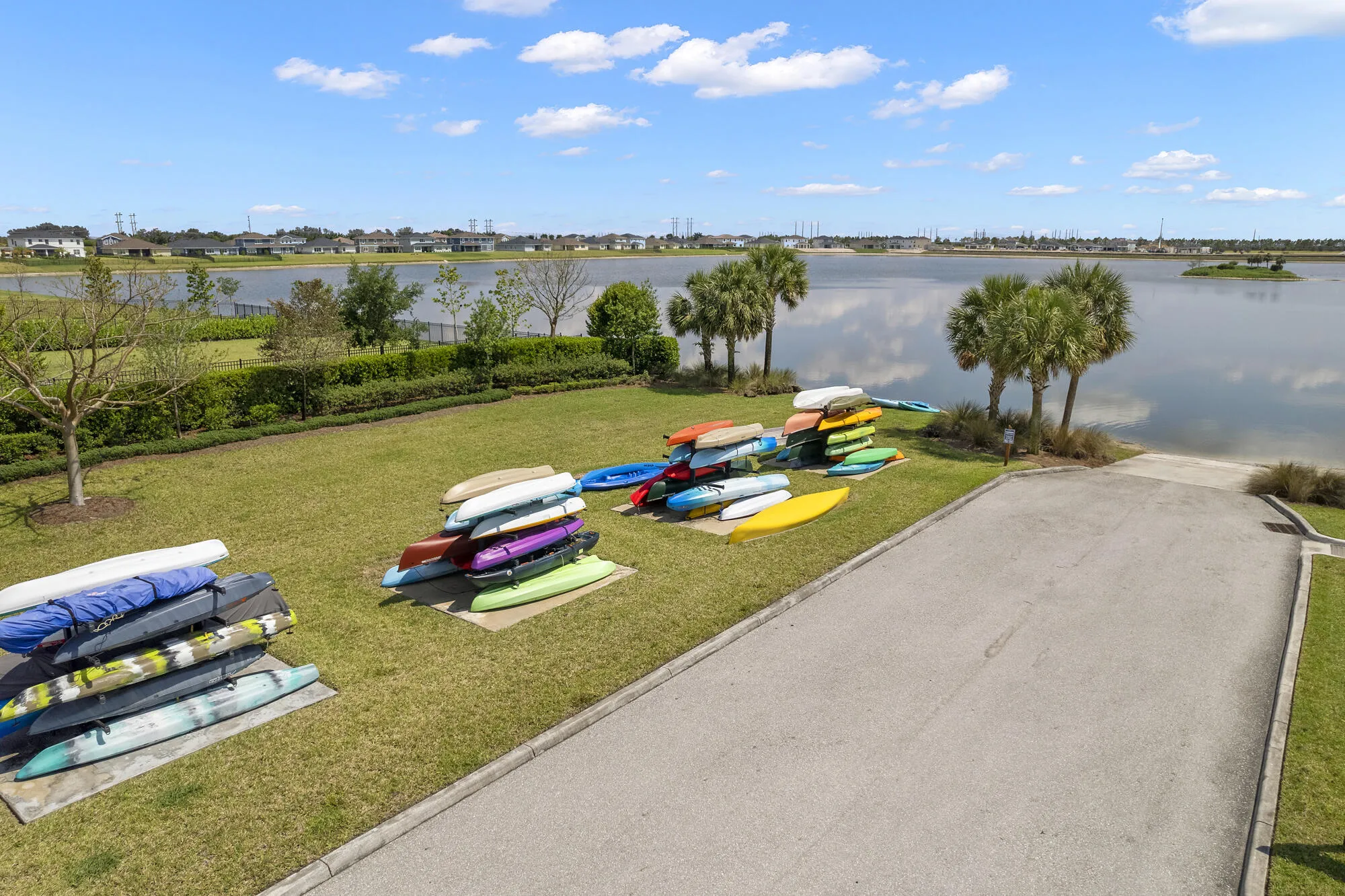 Lakeside property featuring direct water access via a paved boat ramp