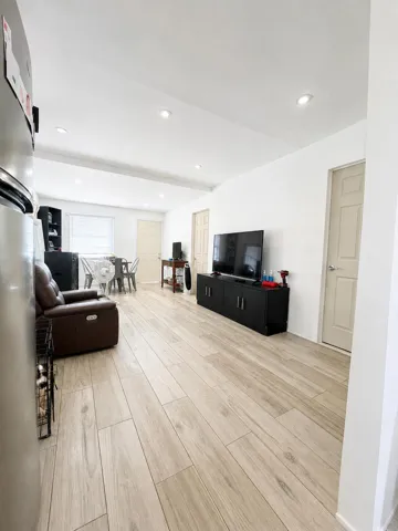 Spacious layout with ample seating and dining for four, flooded with natural light