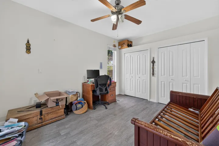 Recessed lighting, wood-finish flooring, ceiling fan, and two bi-fold door closets