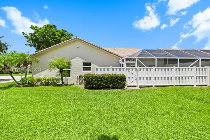 Side view of the home and privacy fence