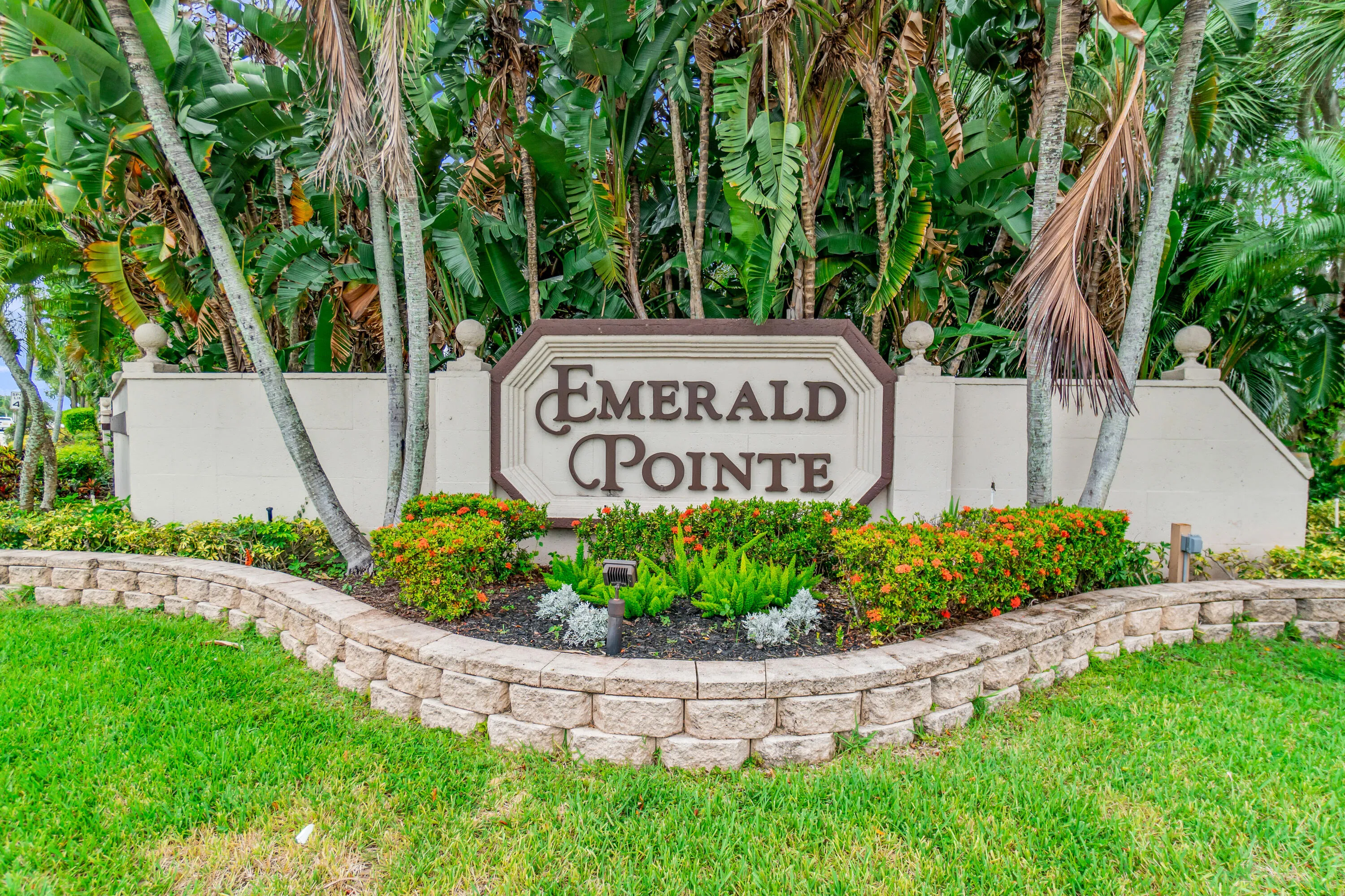Property signage featuring raised lettering and decorative finials