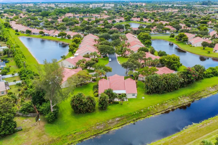 Aerial perspective showcasing a residential community with numerous water features