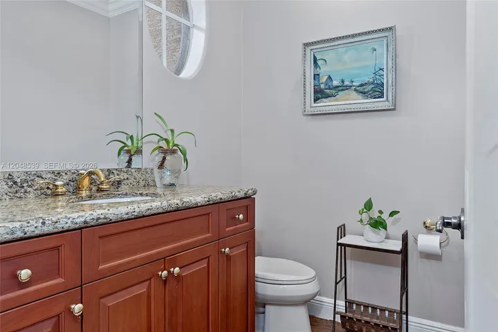Powder half bath easily accessible from living / kitchen/ dining