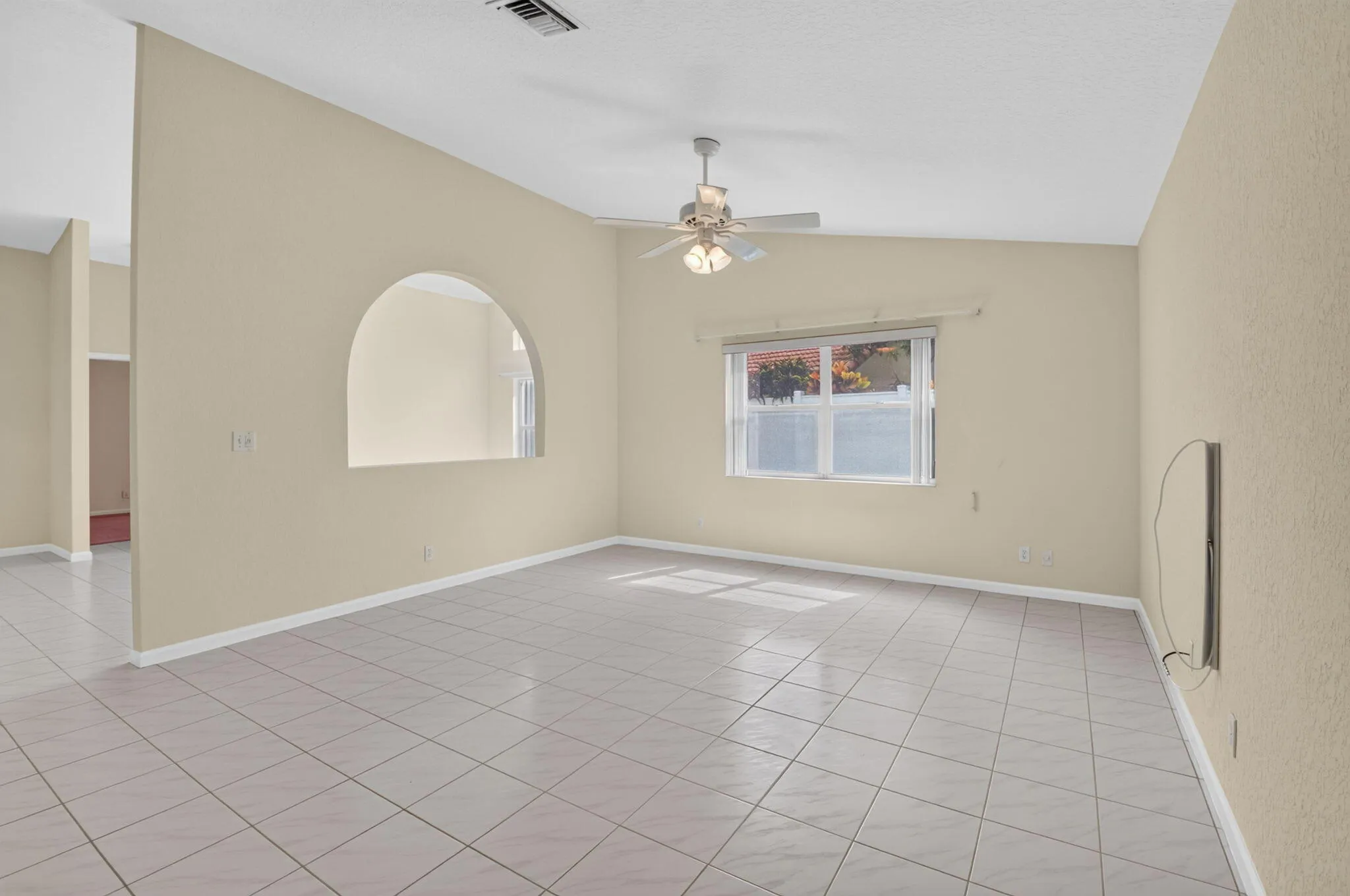 The wall separating the living spaces is not load bearing