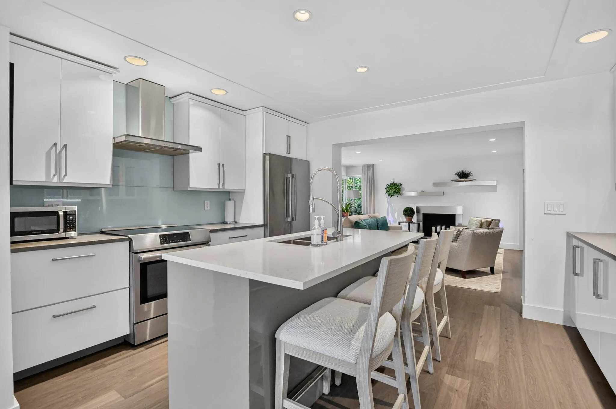 Updated modern kitchen with high-end finishes and appliances open to the living room and dining area allows a wonderful "flow" for entertaining.