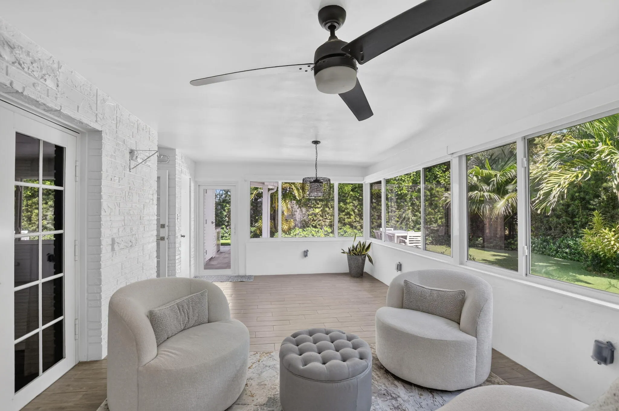 Sunroom has a ceiling fan and light on dimmer, a recently installed A/C split unit for just this (large) room, newly installed custom automatic shades and freshly painted too!