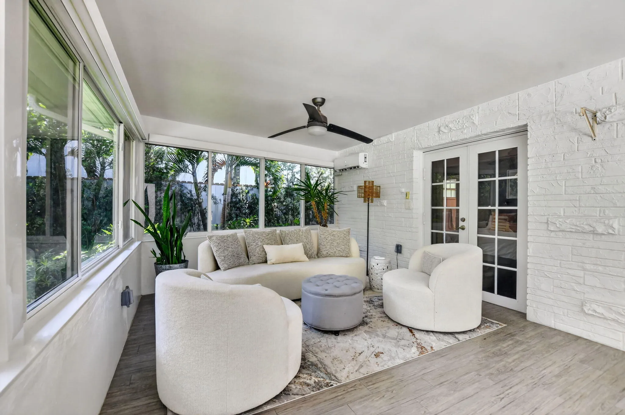 Recently installed windows and screens and high end automatically controlled shades all the way around! The French door glass is treated for privacy, these doors open to the Primary suite.