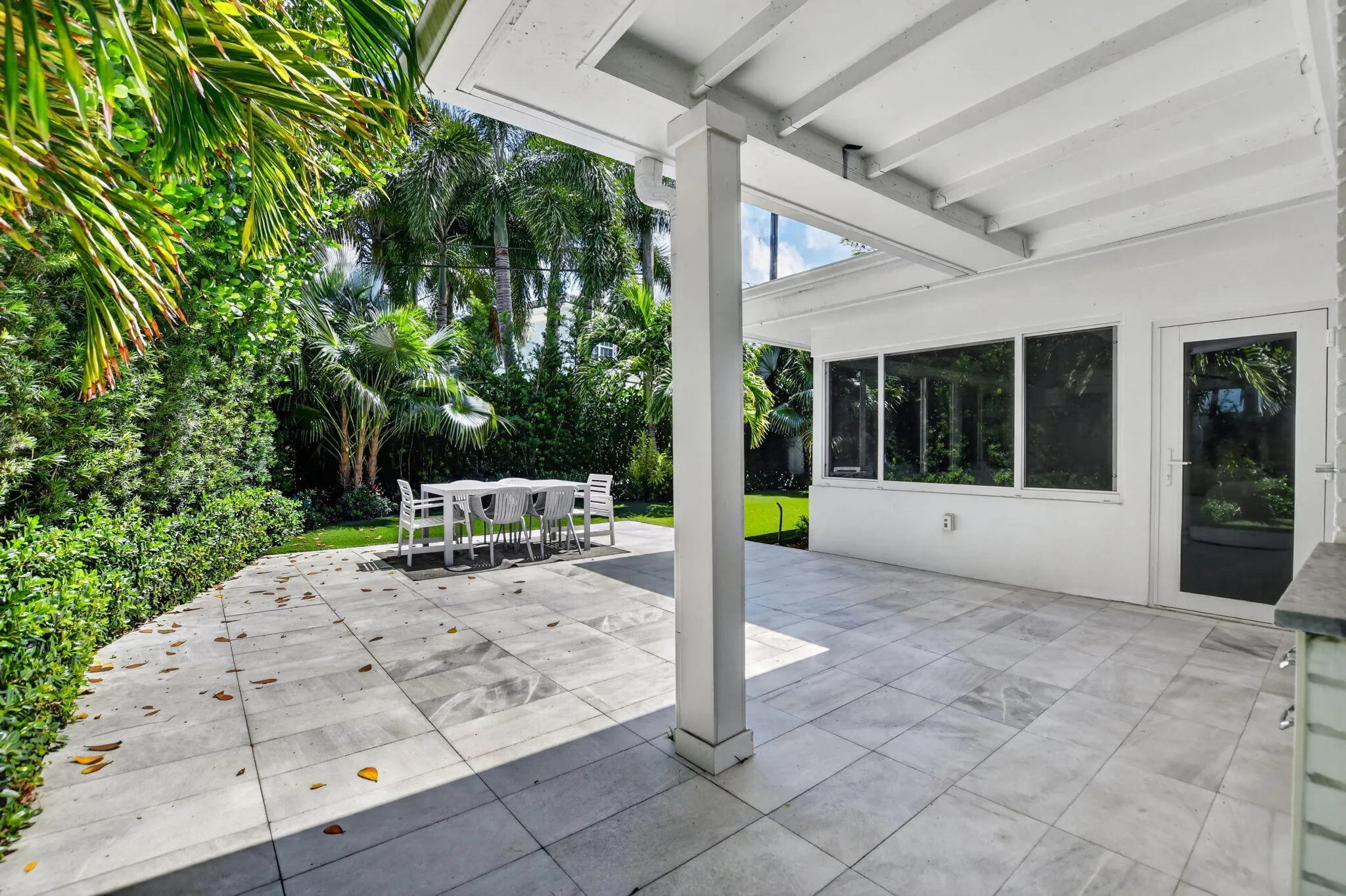 Another view of the covered and open patio area, perfect for entertaining or great space for an outdoor kitchen area!