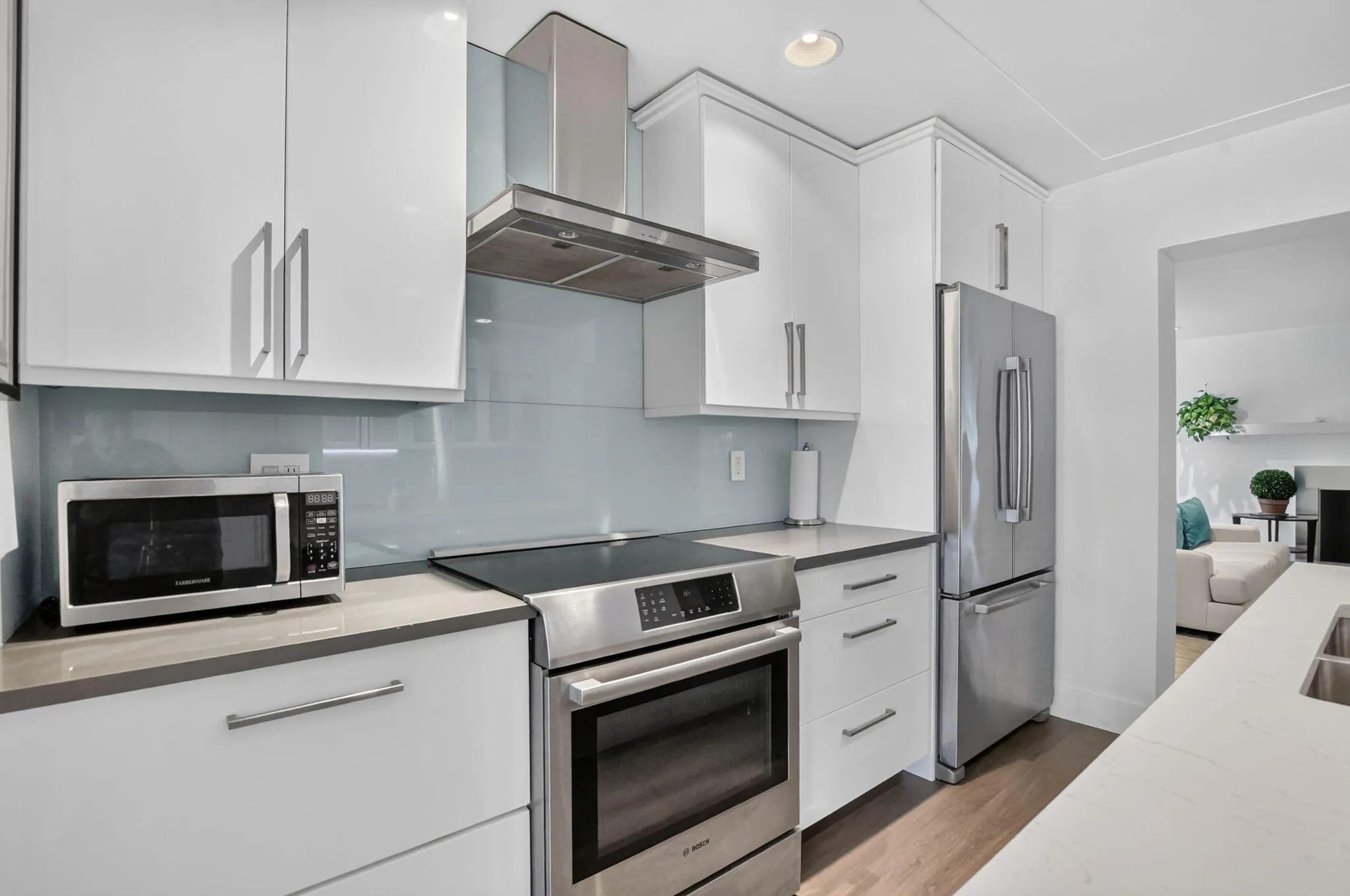 This kitchen has upgraded stainless steel appliances and exhaust fan, double SS sink too!