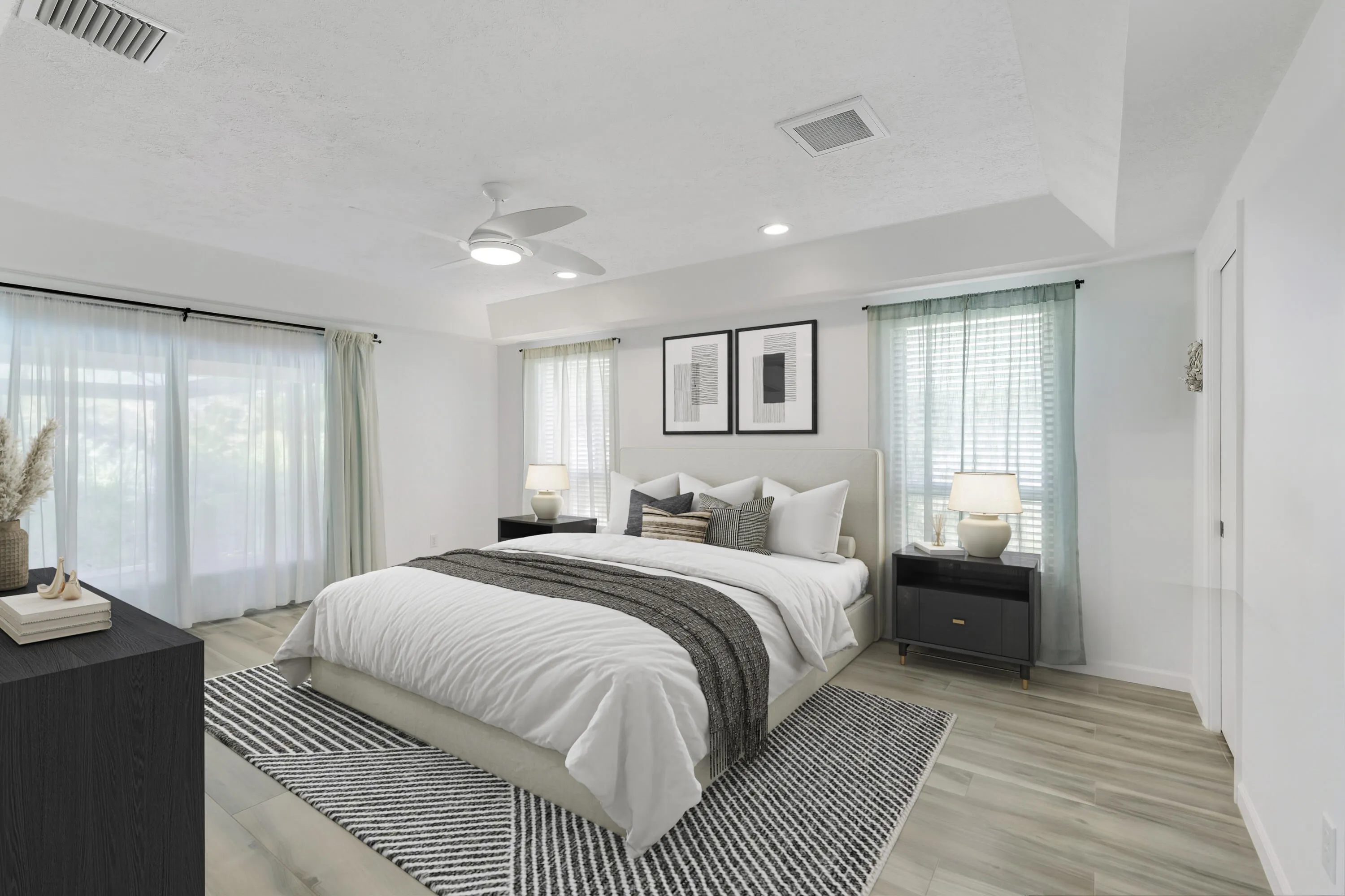 Large primary bedroom with slider to lanai and pool *Virtually Staged*