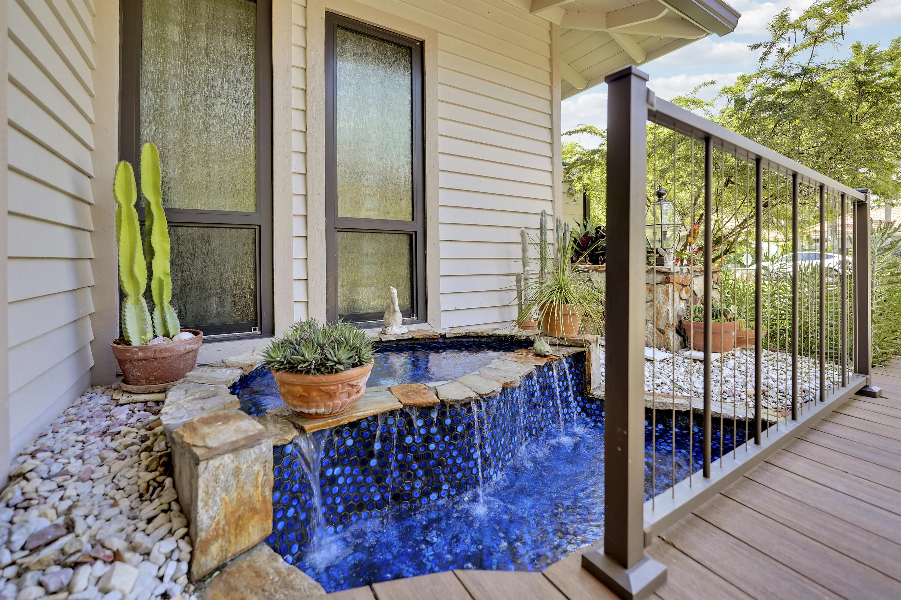 A serene cascading water feature creates a warm, welcoming focal point for visitors