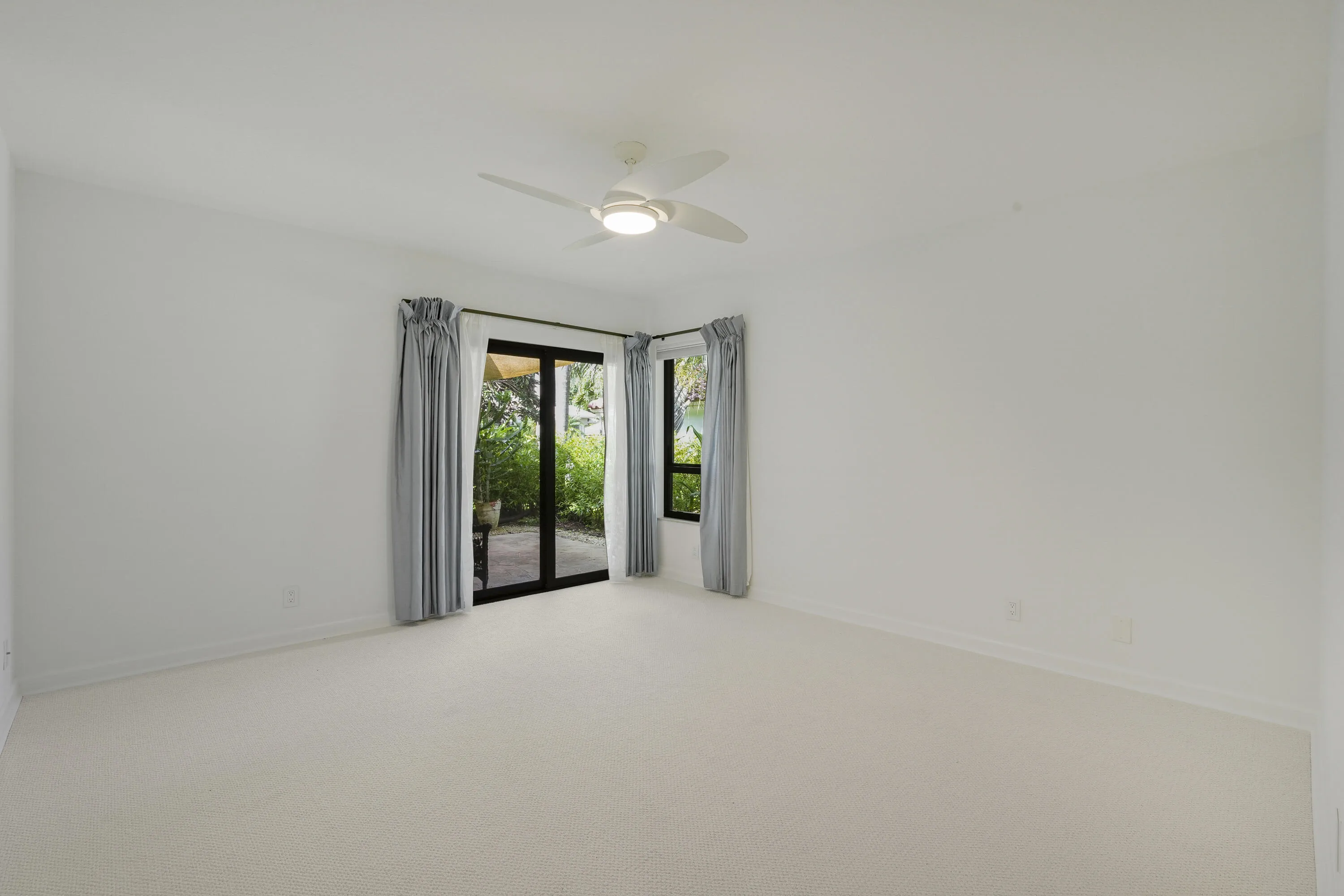 Guestroom offering direct access to a cozy outdoor sitting space.”