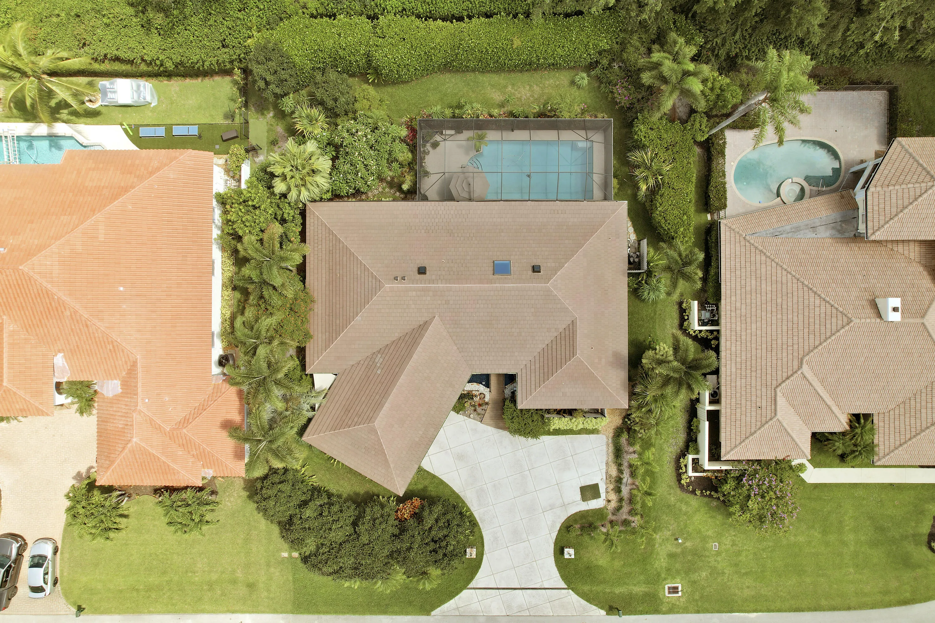 A beautiful aerial view highlighting the home’s expansive lot, mature landscaping, and private setting.