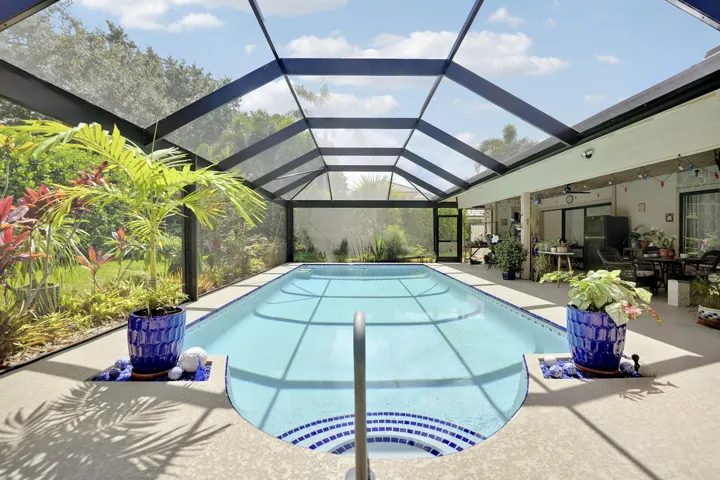 New Semi Frameless Screen Enclosure and upgraded pool deck (resurfaced)