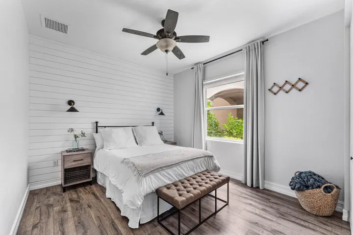 Downstairs bedroom with shiplap feature wall