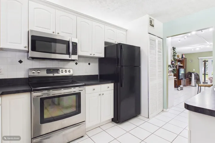 Stackable washer and dryer in kitchen closet