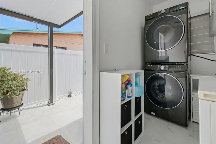 Laundry and door to back patio