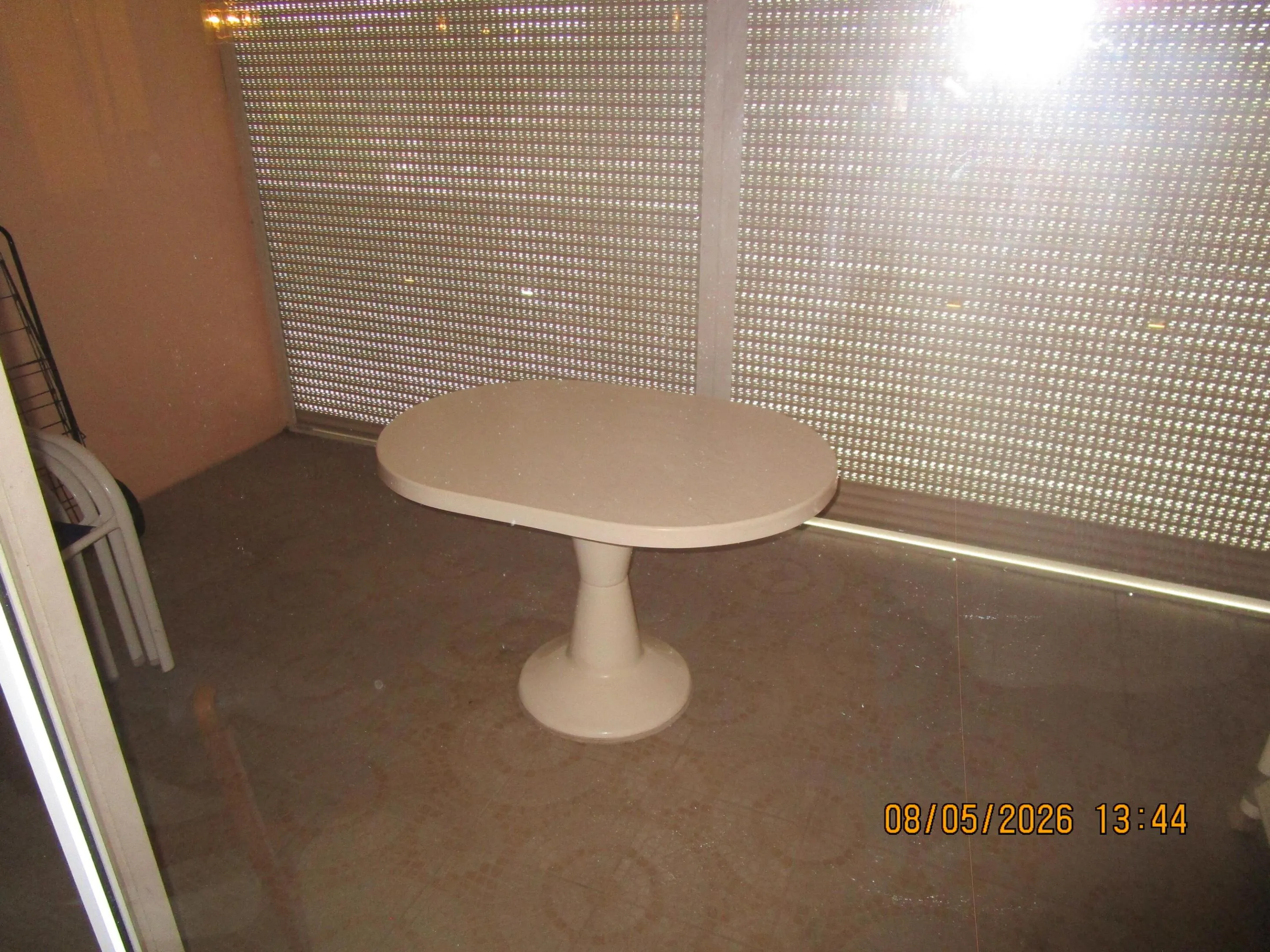 screened patio with roll down shutters