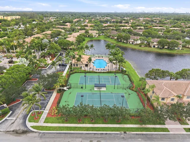 Community amenities featuring two tennis courts, an outdoor swimming pool, and a waterfront setting